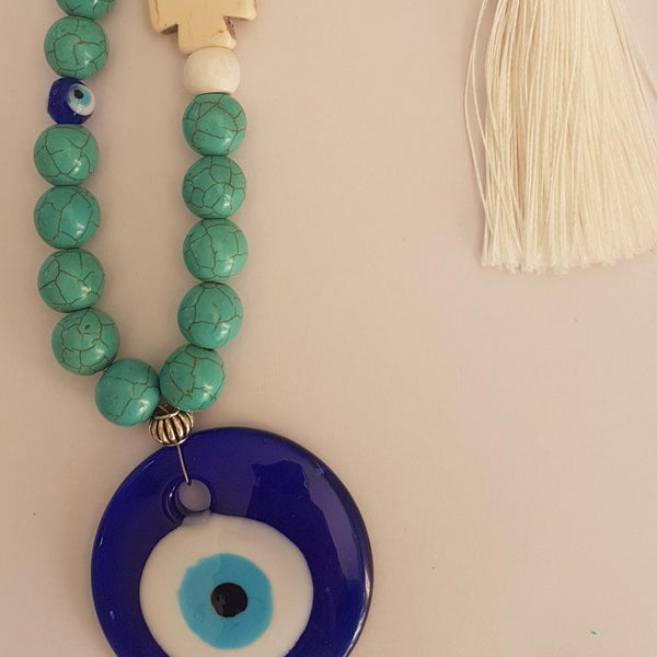 Turquise blue round bead mati wall hanging with beige cross and tassel