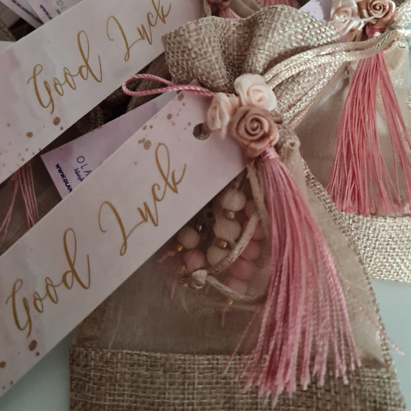 Beige and pink keyrings in a bag