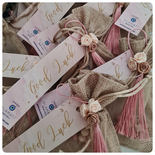 Beige and pink keyrings in a bag