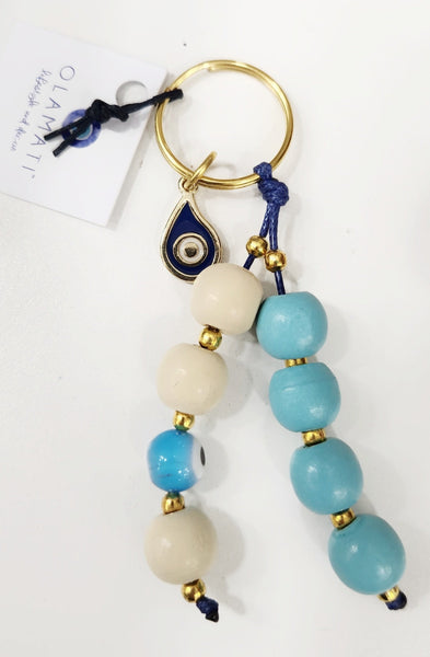 Turquoise blue and beige bead keyring with mati