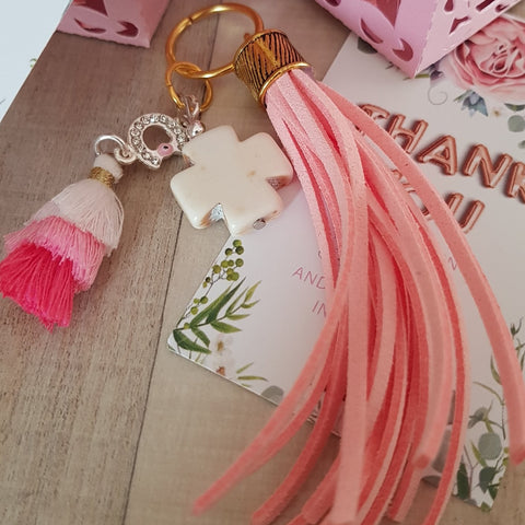 Baby pink keyring with cross and tassel