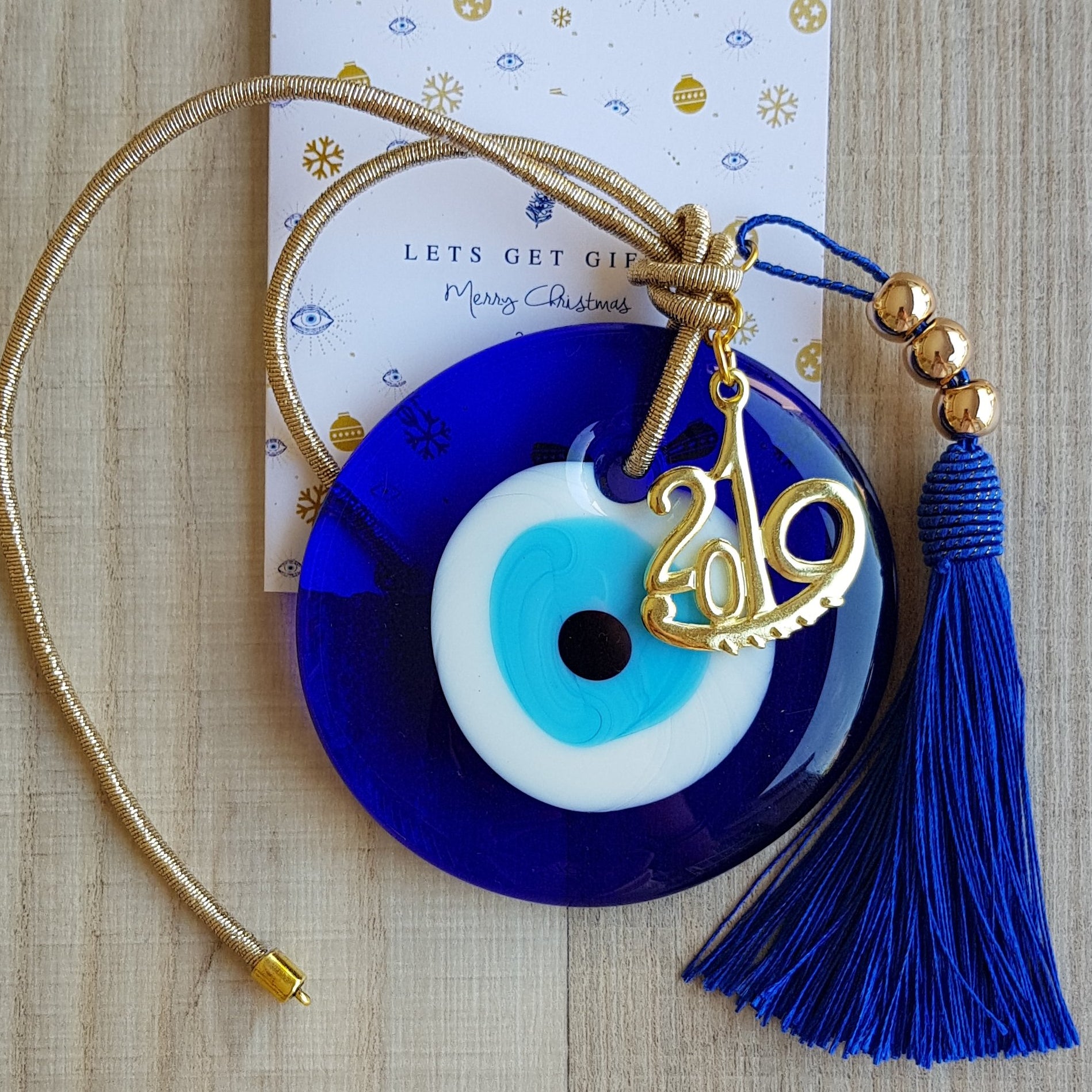 Gold mati wall hanging with blue tassel - Christmas collection