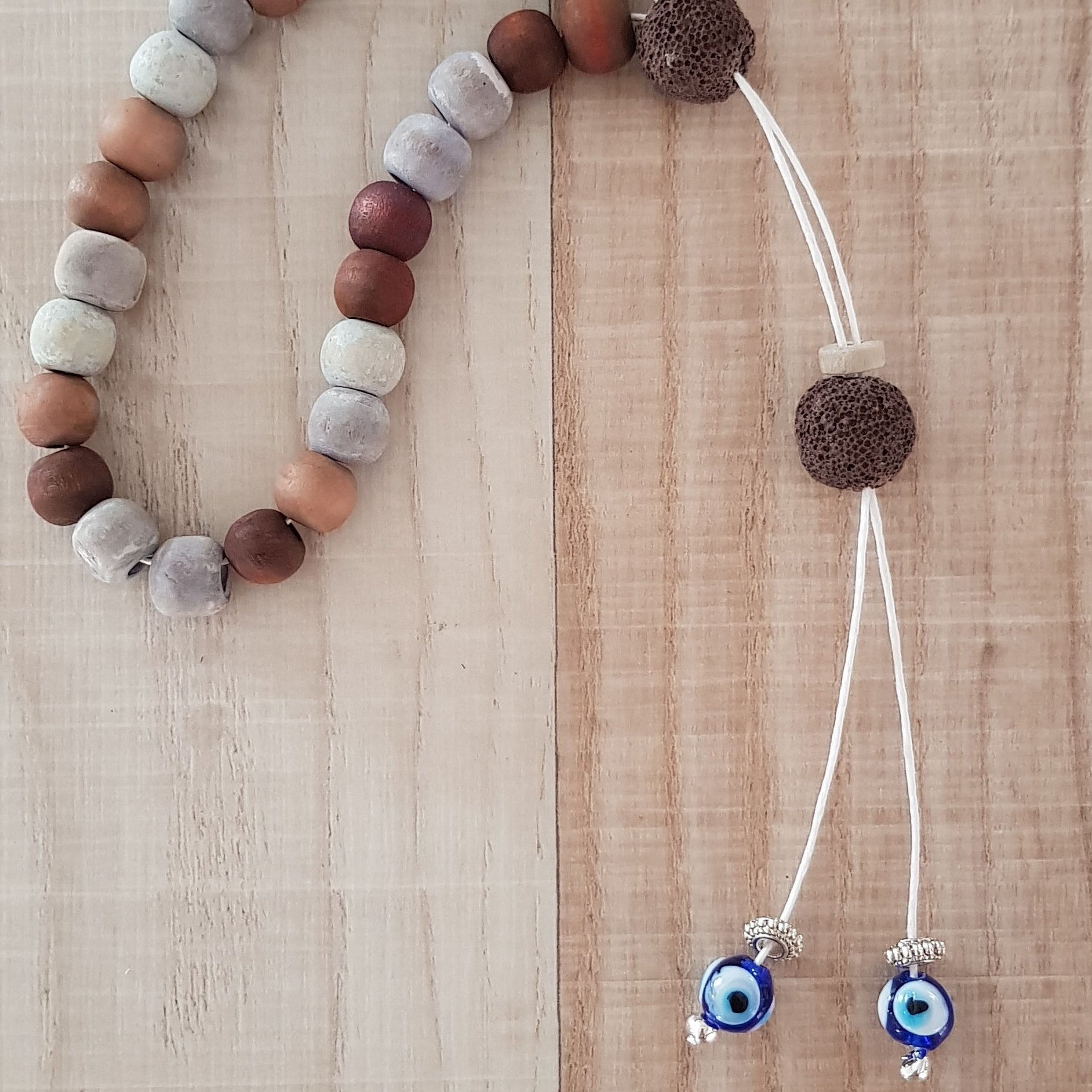 Brown and beige bead komboloi with mati beads