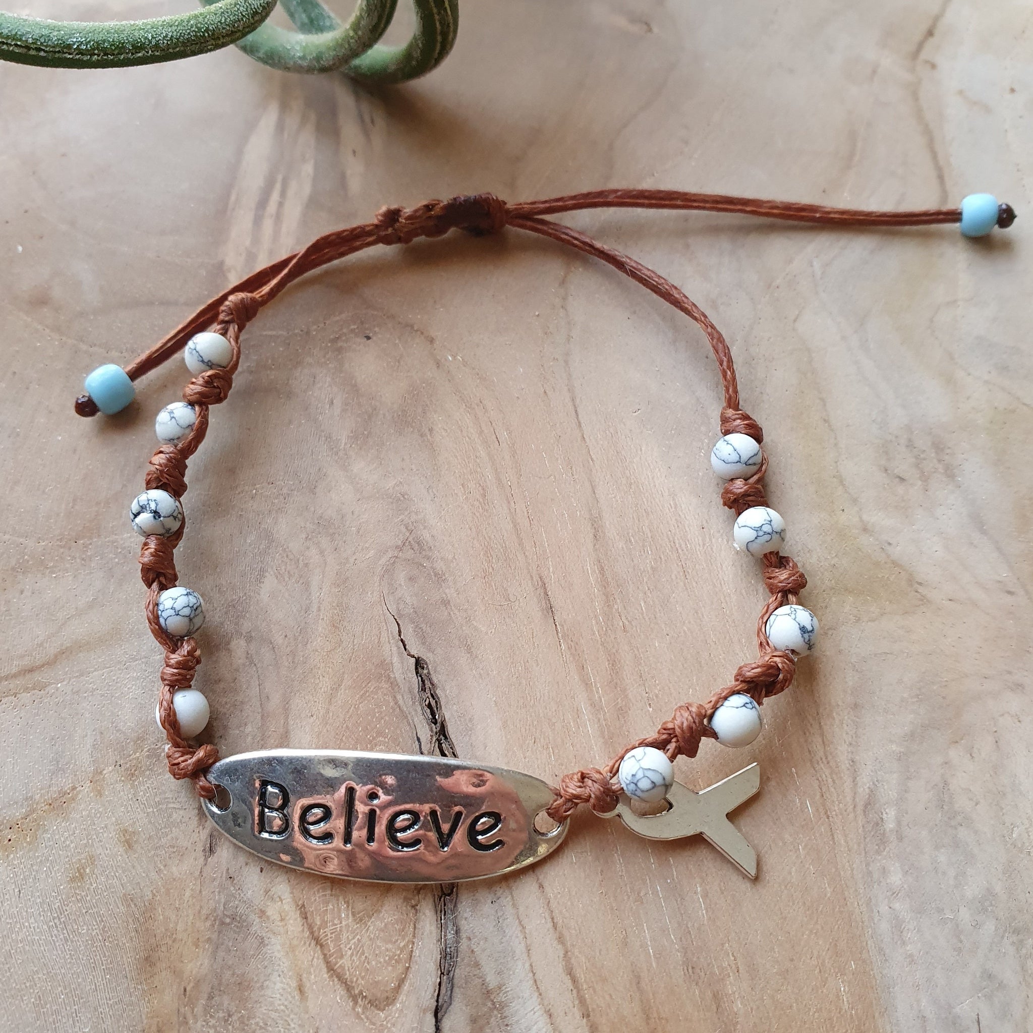Believe bracelet with beige stones and cancer ribbon