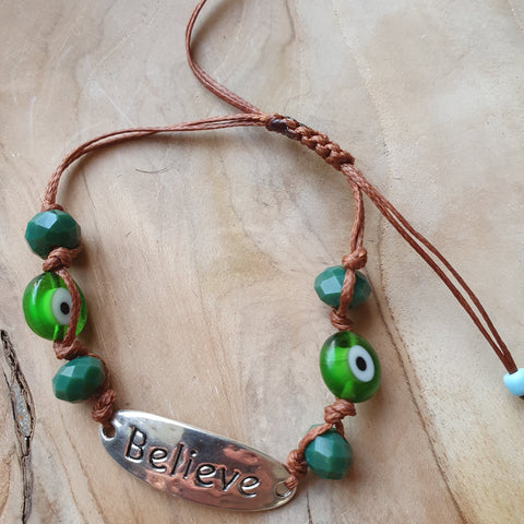 Believe bracelet with green stones and eyes
