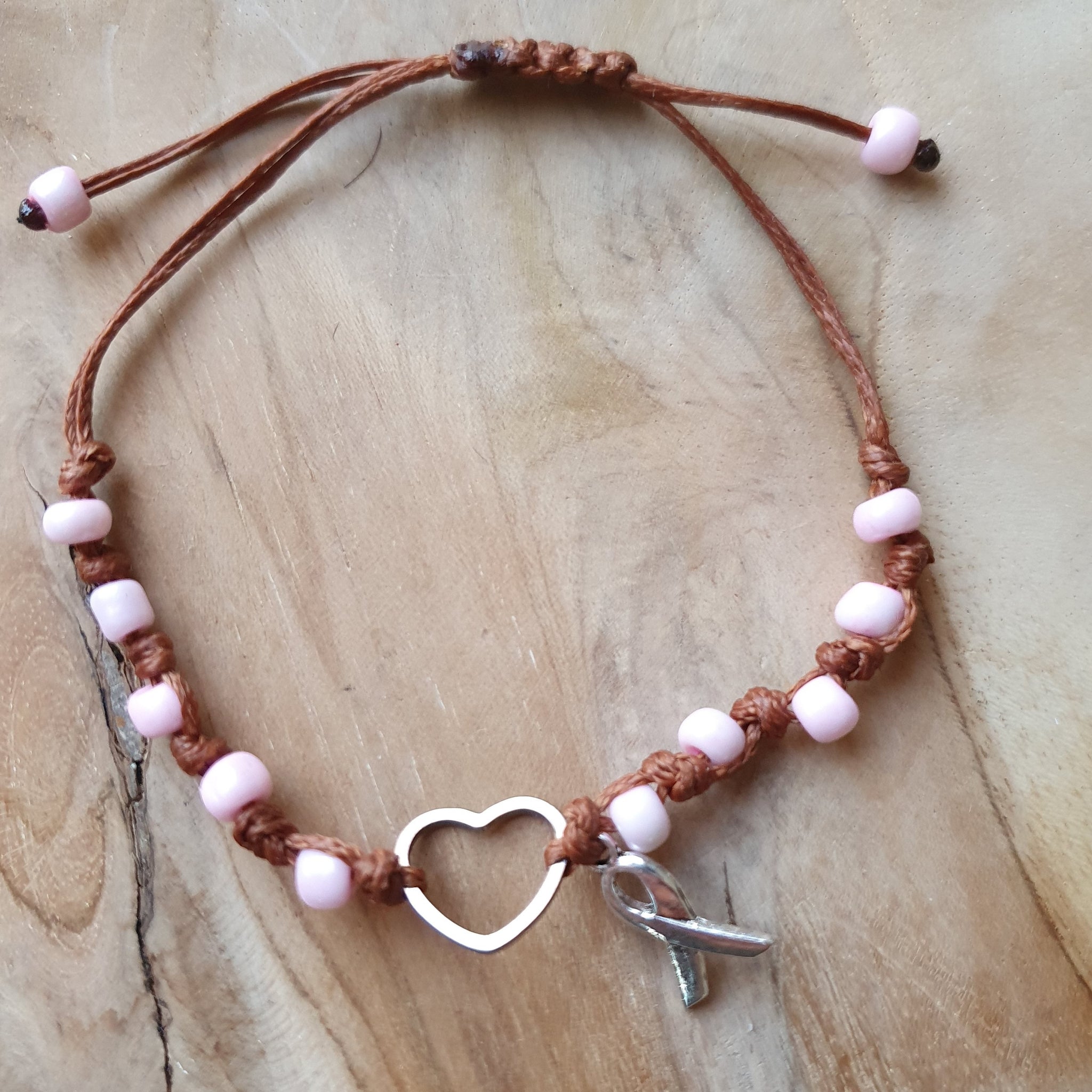 Silver stainless steel heart bracelet with pink beads