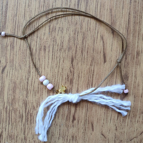 pink bracelet with tassel