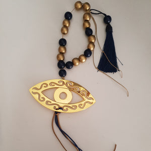 Gold and navy blue mati wall hanging with gold or navy tassel