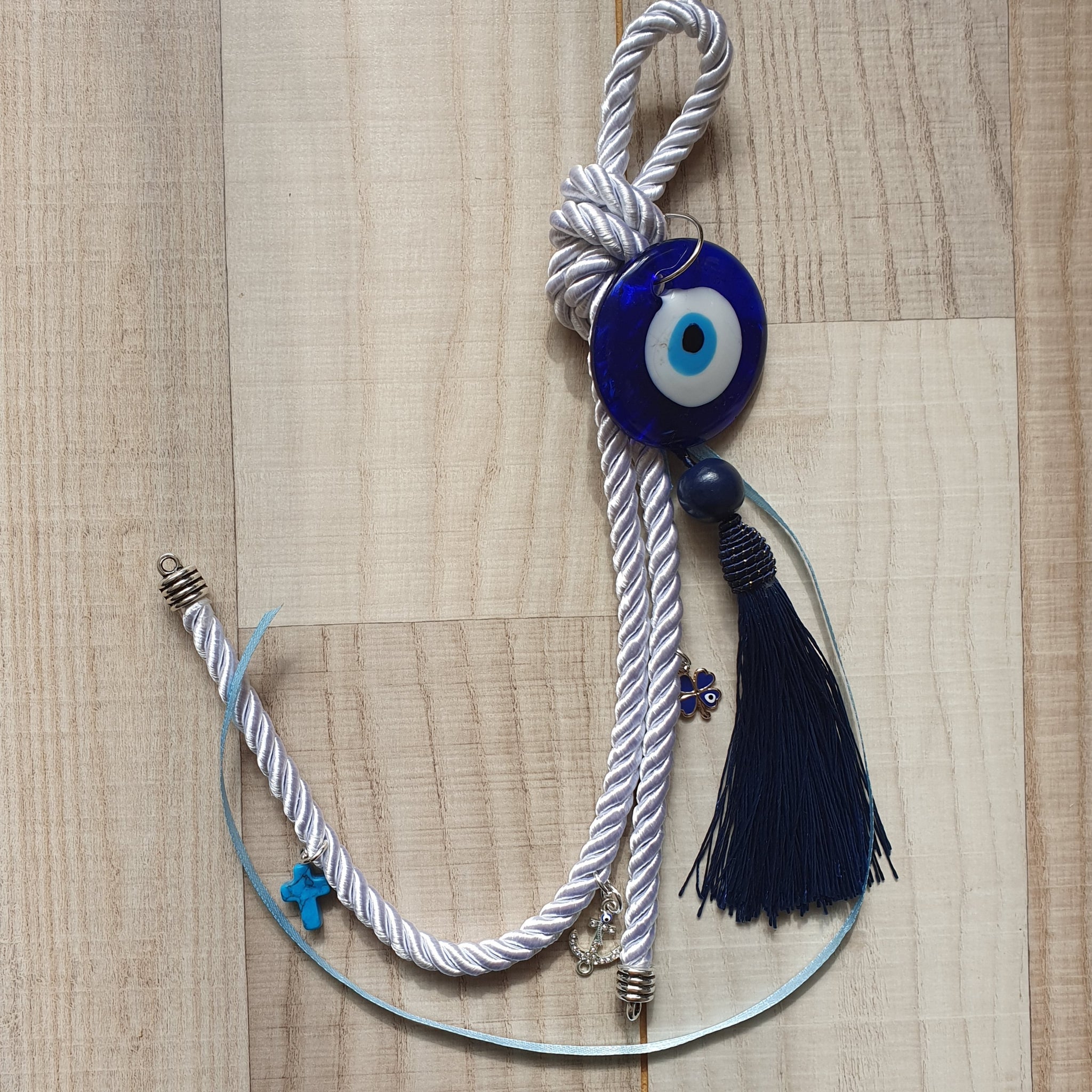 White gouri with navy tassel, anchor, blue cross and clover